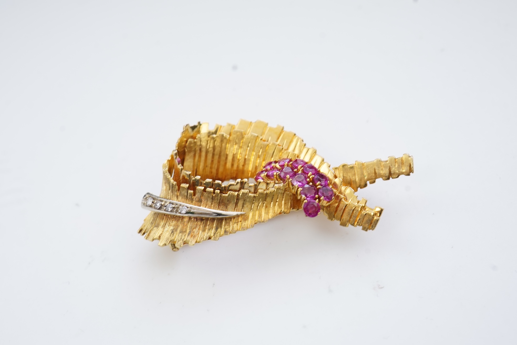 A gold, ruby and diamond brooch, circa 1965